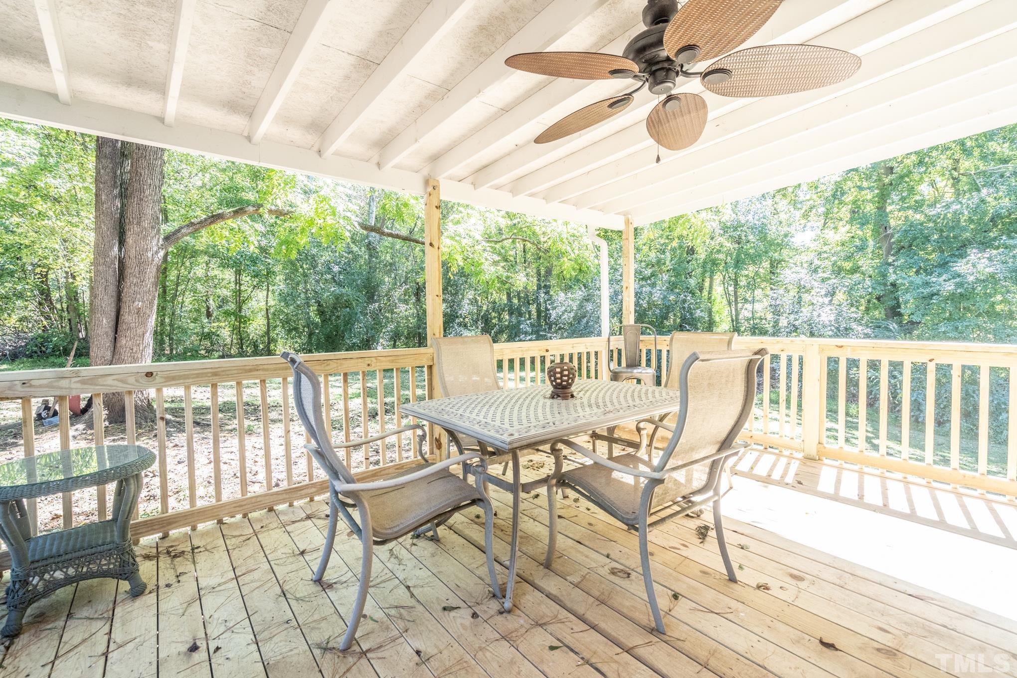 109 Old Watkins Road Henderson, NC 27537 - Photo 4 of 12 a view of a dining room with furniture a chandelier and wooden floor