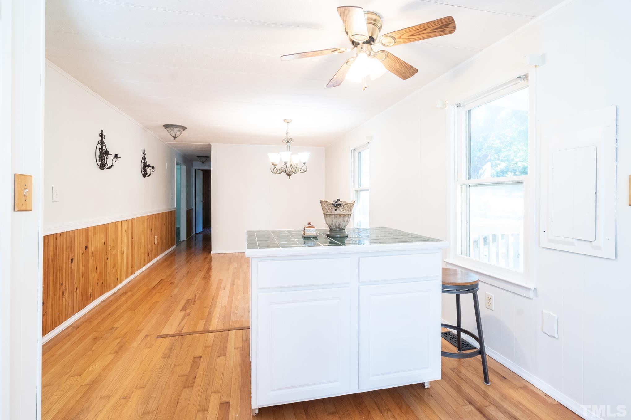 109 Old Watkins Road Henderson, NC 27537 - Photo 10 of 12 a view of a kitchen with a sink and a window