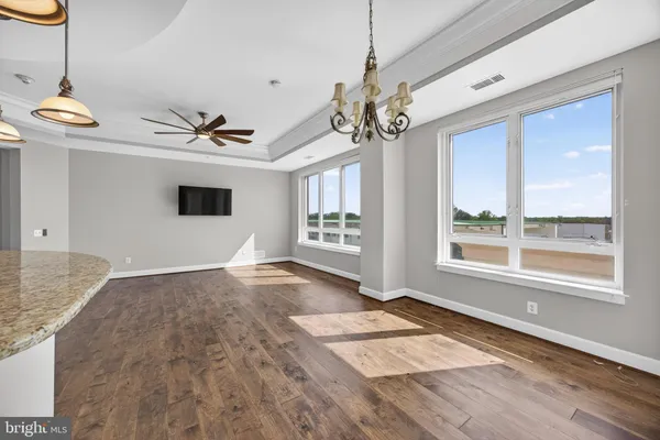 a view of a balcony with wooden floor