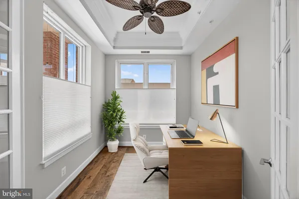 a kitchen with kitchen island granite countertop a sink a counter top space stainless steel appliances and cabinets