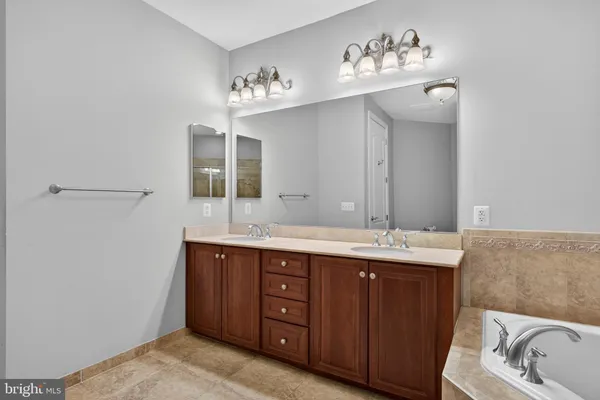 a bathroom with a shower and a glass door
