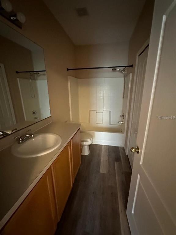 5882 Fishhawk Ridge Drive Lithia, FL 33547 - Photo 13 of 34 a bathroom with a sink a toilet and shower