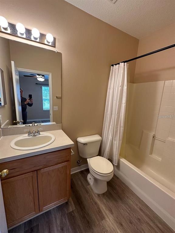 5882 Fishhawk Ridge Drive Lithia, FL 33547 - Photo 18 of 34 a bathroom with a sink toilet a mirror and shower