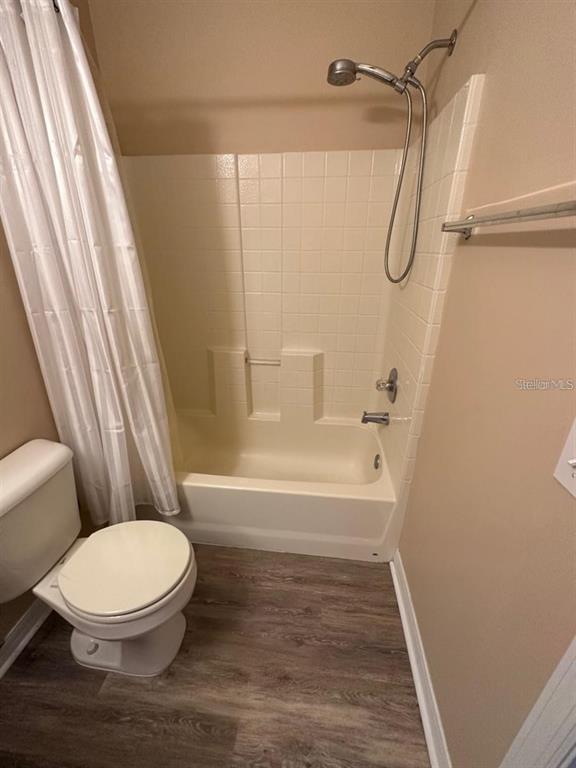 5882 Fishhawk Ridge Drive Lithia, FL 33547 - Photo 20 of 34 a bathroom with a toilet and a shower