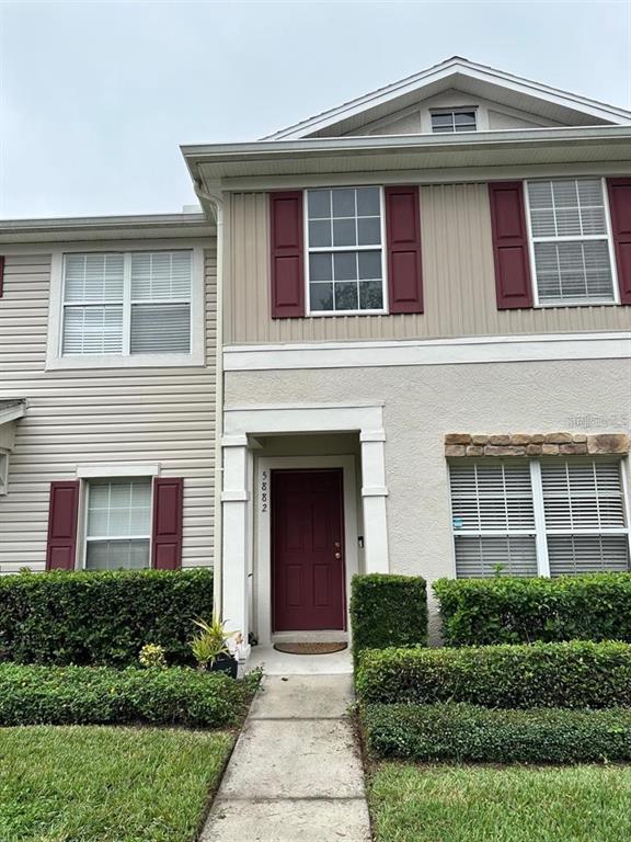 5882 Fishhawk Ridge Drive Lithia, FL 33547 - Photo 2 of 34 a front view of a house with garden