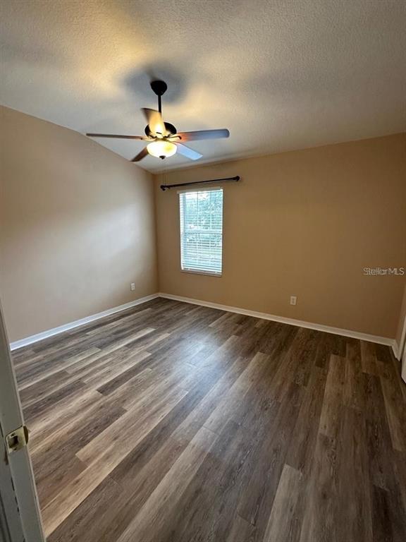 5882 Fishhawk Ridge Drive Lithia, FL 33547 - Photo 21 of 34 wooden floor in an empty room with a window