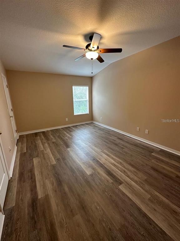 5882 Fishhawk Ridge Drive Lithia, FL 33547 - Photo 26 of 34 wooden floor in an empty room with a window