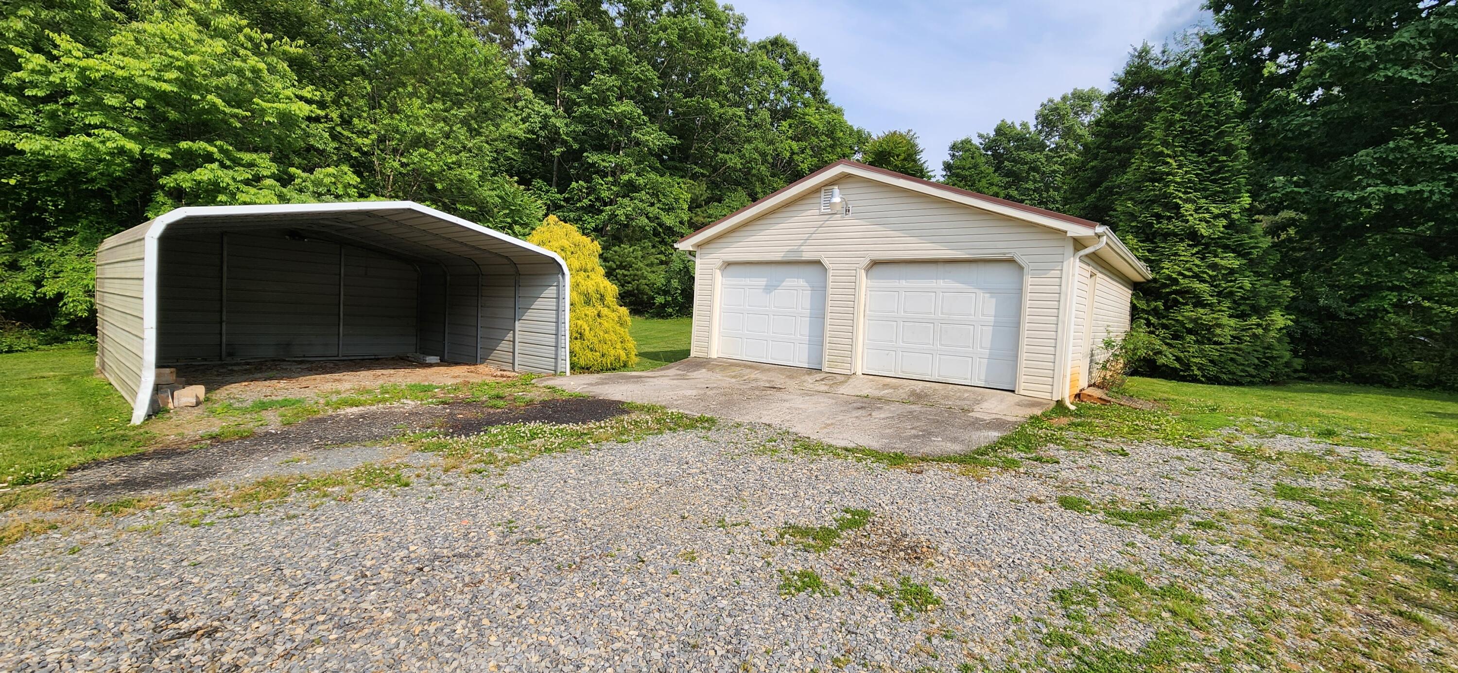 2805 Ruritan Road Rocky Mount, VA 24151 - Photo 20 of 24 a view of a house with a yard and large tree