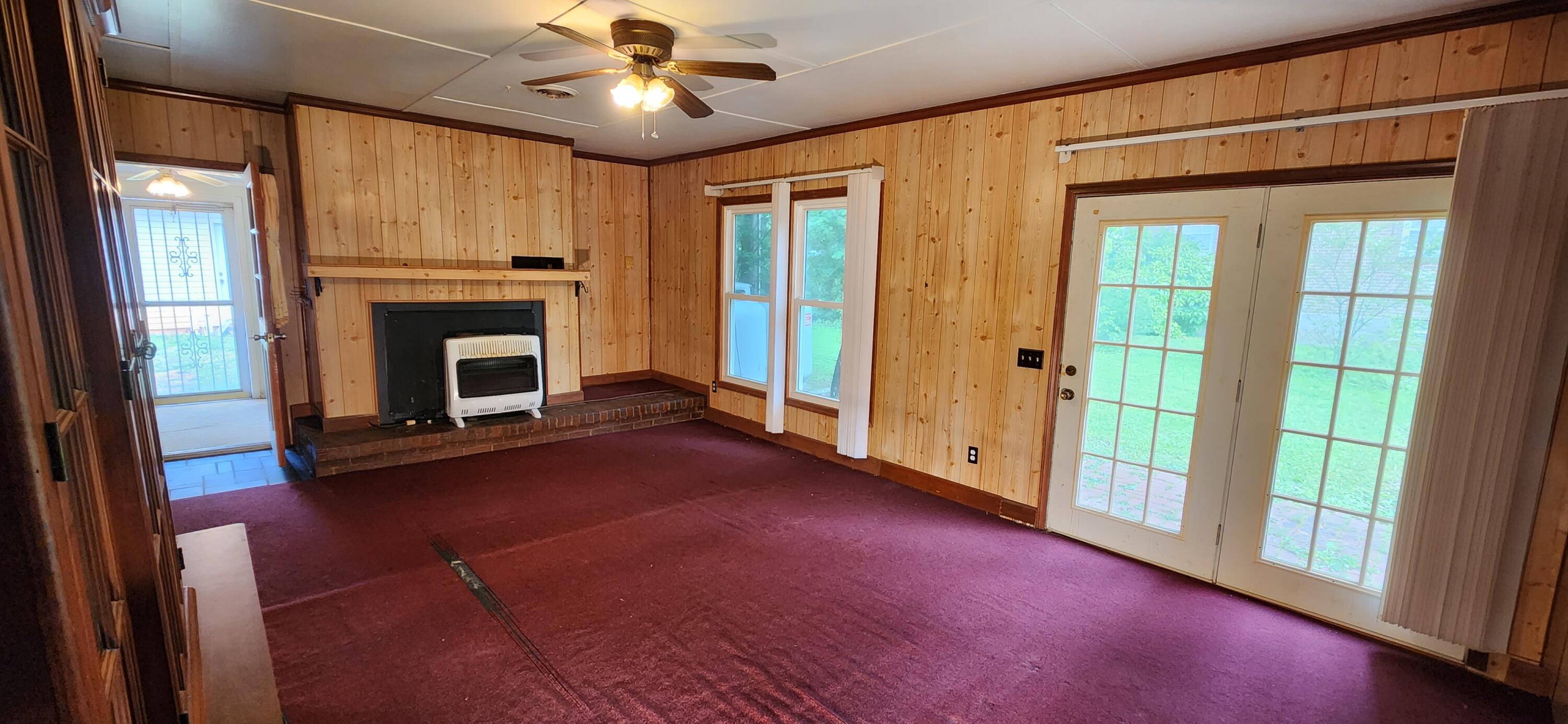 2805 Ruritan Road Rocky Mount, VA 24151 - Photo 8 of 24 a view of empty room with fireplace and fan