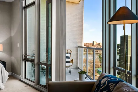a living room filled with furniture and a window