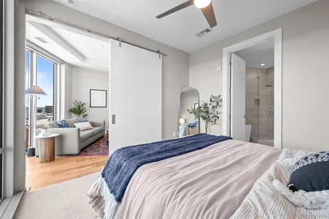 a bedroom with a large bed and furniture