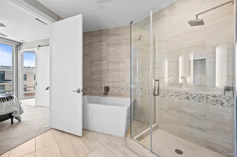 a bathroom with a shower and a sink