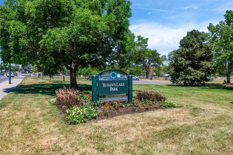 a garden with trees in front of it
