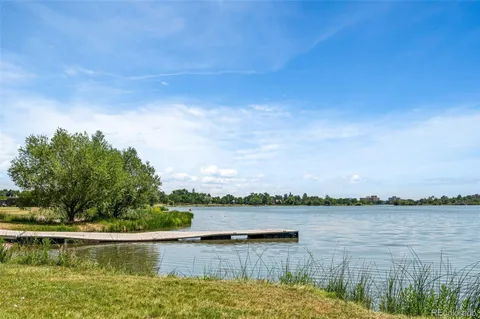 a view of a lake with houses in the back