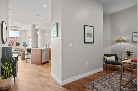 a view of kitchen with furniture and entryway