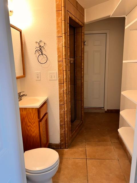 3019 Lathrop Road Manteca, CA 95336 - Photo 40 of 43 a bathroom with a toilet sink and mirror