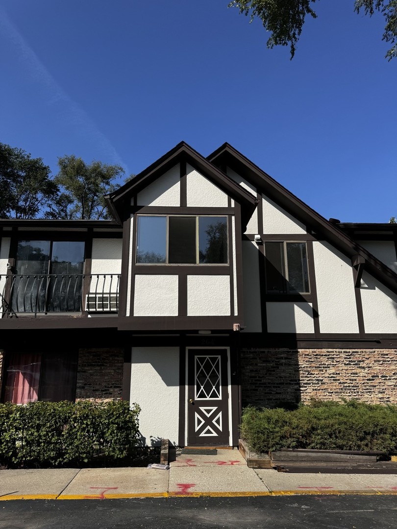 a front view of a house with garage