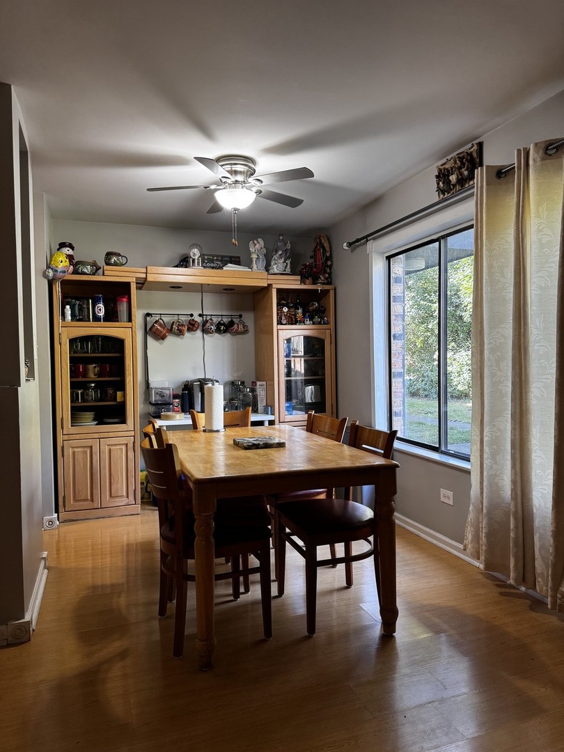 264 George Street, Unit A Bensenville, IL 60106 - Photo 4 of 7 a view of a dining room with furniture window and wooden floor
