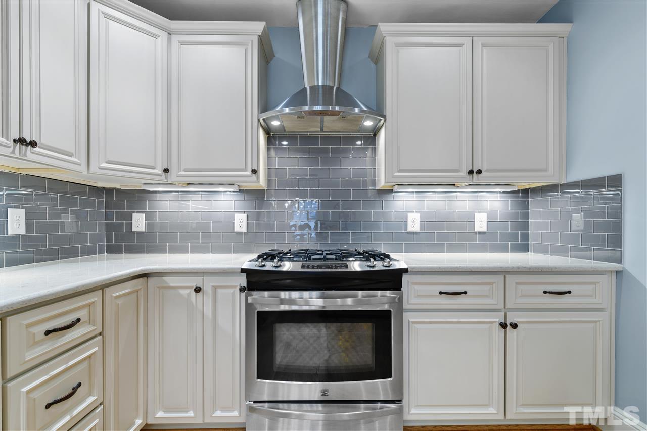2618 Van Dyke Avenue Raleigh, NC 27607 - Photo 8 of 30 a stove top oven sitting inside of a kitchen