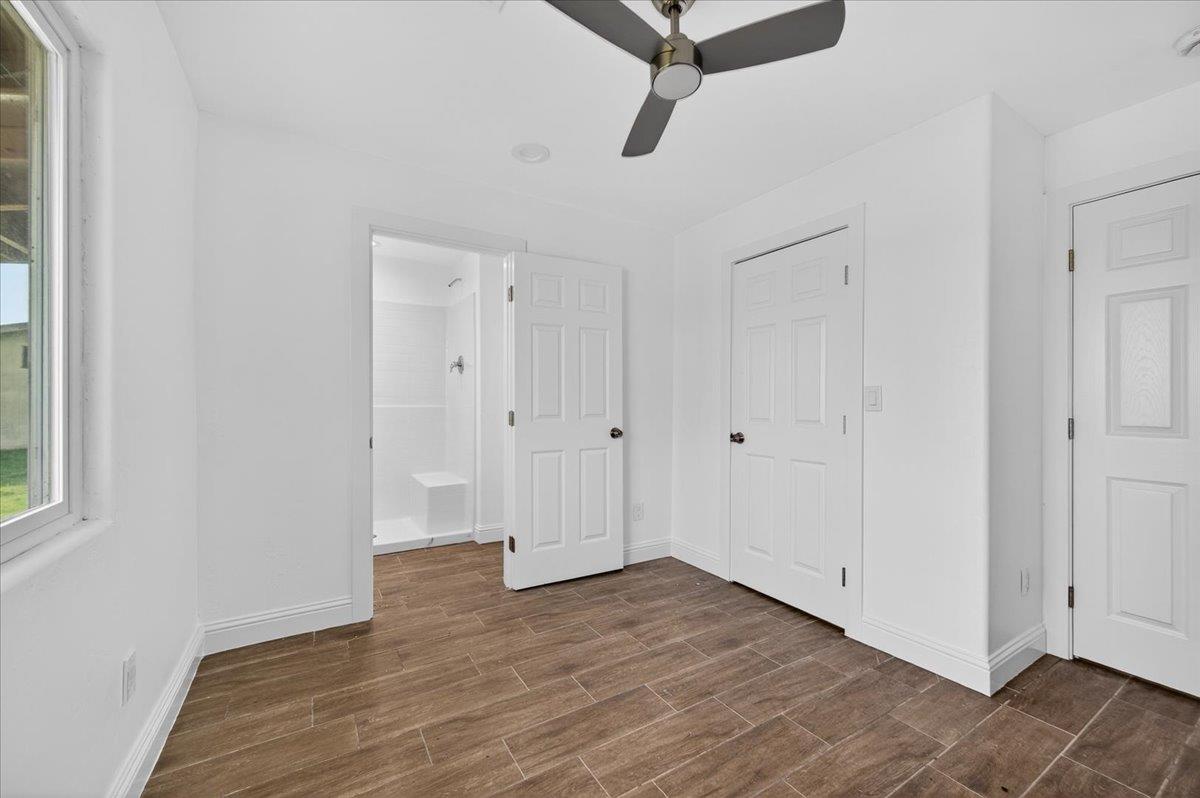 6873 20th Avenue Lemoore, CA 93245 - Photo 12 of 90 a view of a room with wooden floor and white walls