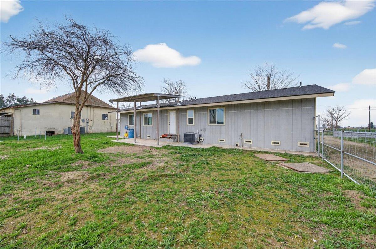 6873 20th Avenue Lemoore, CA 93245 - Photo 18 of 90 a view of a house with a yard and sitting area