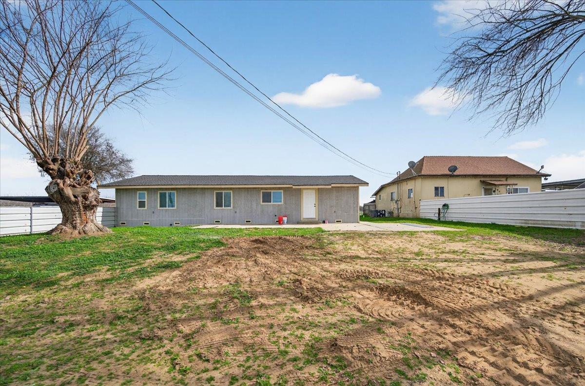 6873 20th Avenue Lemoore, CA 93245 - Photo 2 of 90 a view of a house with a yard