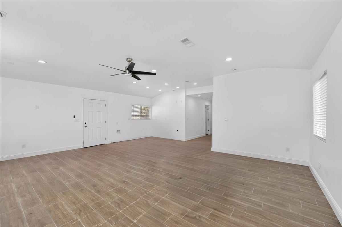6873 20th Avenue Lemoore, CA 93245 - Photo 84 of 90 an empty room with a white walls and ceiling fan