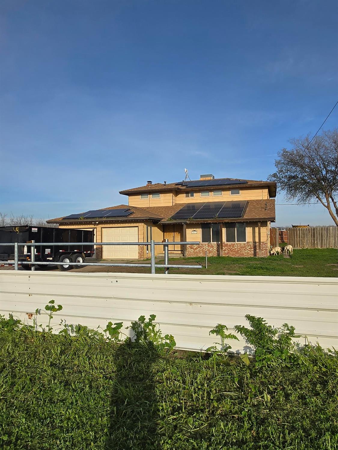 6873 20th Avenue Lemoore, CA 93245 - Photo 89 of 90 a view of a swimming pool with an outdoor seating and a garden