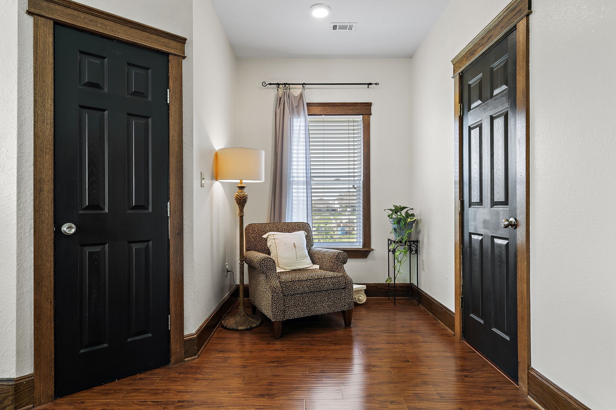 10411 County Road 65 Rosharon, TX 77583 - Photo 17 of 29 Cozy yet spacious, the primary bedroom is highlighted by a charming reading nook and three sun-filled windows that create a peaceful place to unwind.