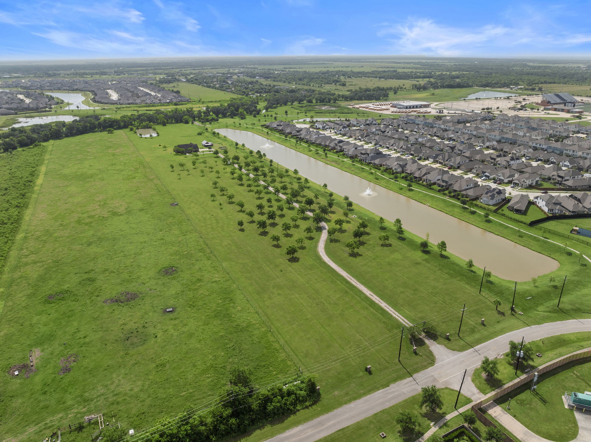 10411 County Road 65 Rosharon, TX 77583 - Photo 29 of 29 This true country oasis offers open green space, mature trees, and a peaceful pond, all while being just minutes from everyday conveniences.