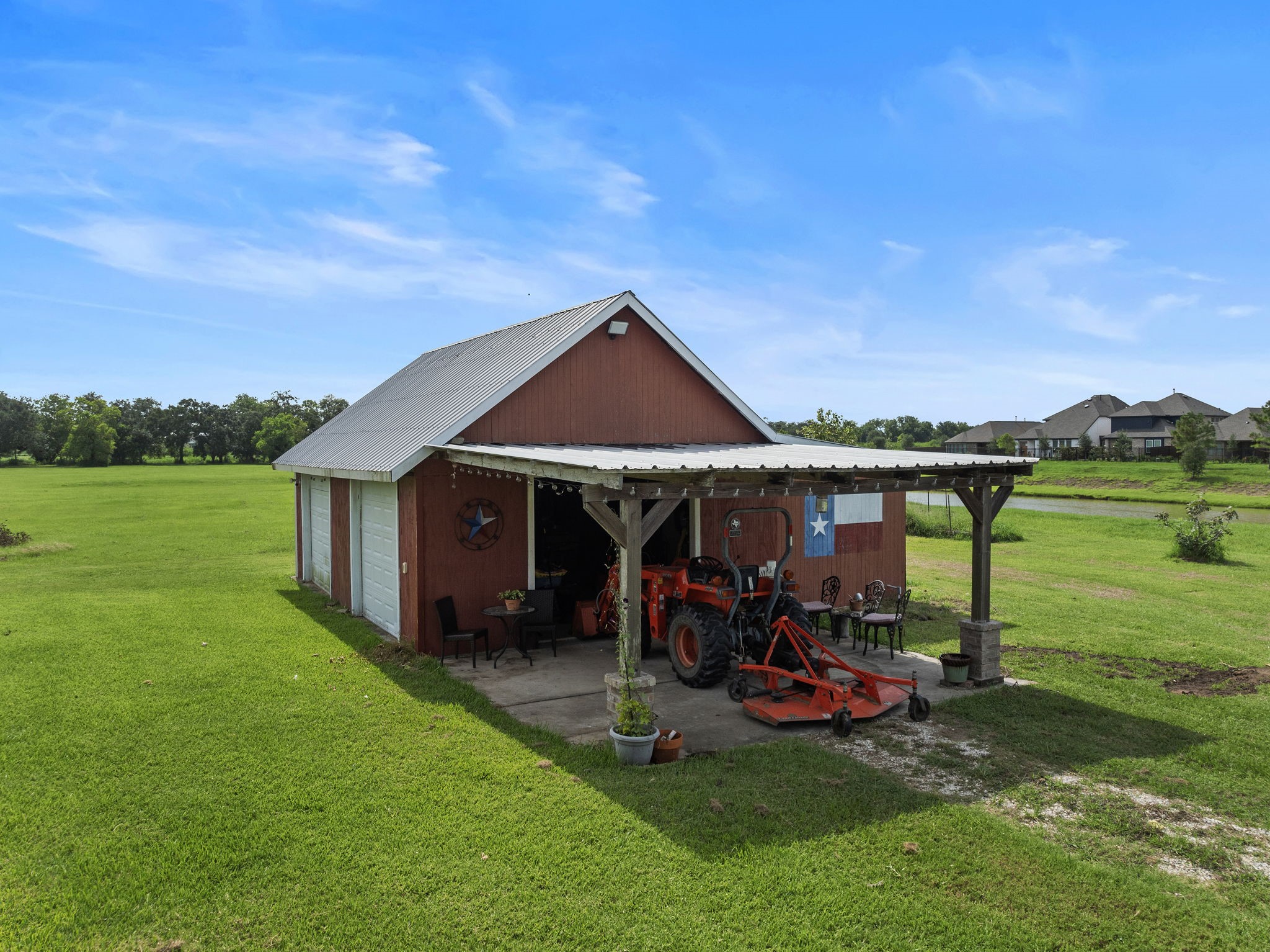 10411 County Road 65 Rosharon, TX 77583 - Photo 6 of 29 The charming red barn features a sink with running water, storage space, and a custom woodworking bench, making it ideal for hobbies or equipment.