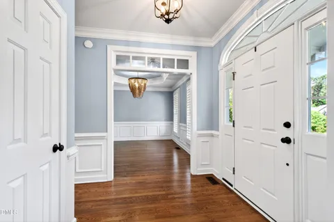 a view of an entryway with wooden floor