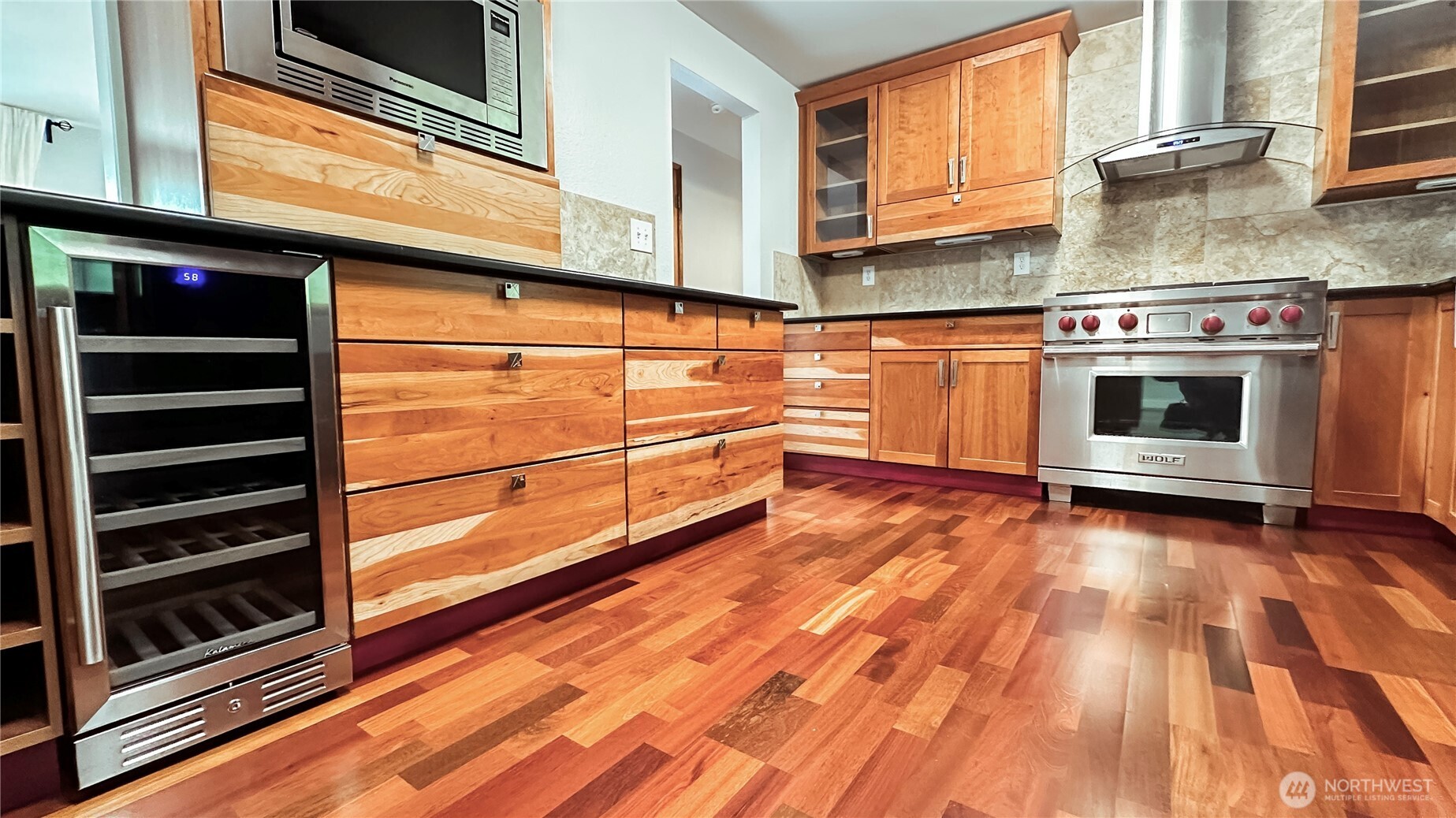 2830 216th Avenue Southeast Sammamish, WA 98075 - Photo 12 of 23 a kitchen with wooden floors and a stove