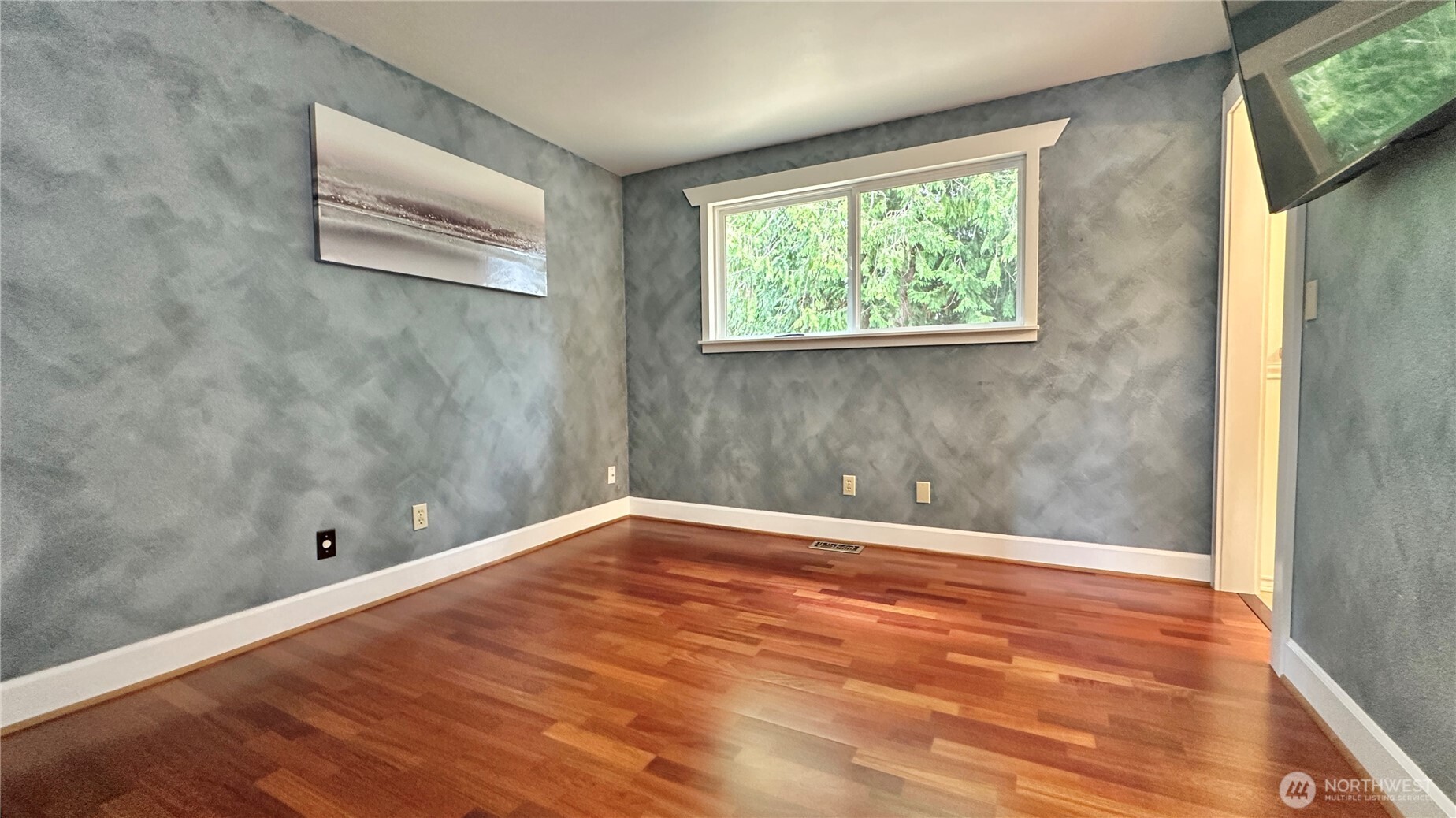 2830 216th Avenue Southeast Sammamish, WA 98075 - Photo 17 of 23 an empty room with wooden floor and windows