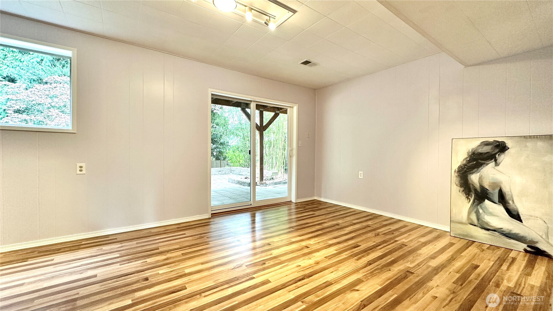 2830 216th Avenue Southeast Sammamish, WA 98075 - Photo 22 of 23 a view of a room with wooden floor and a window