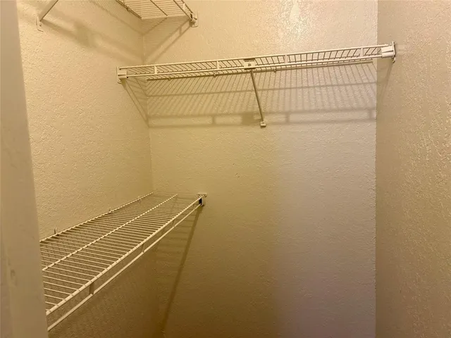 a view of a room with racks on the wall