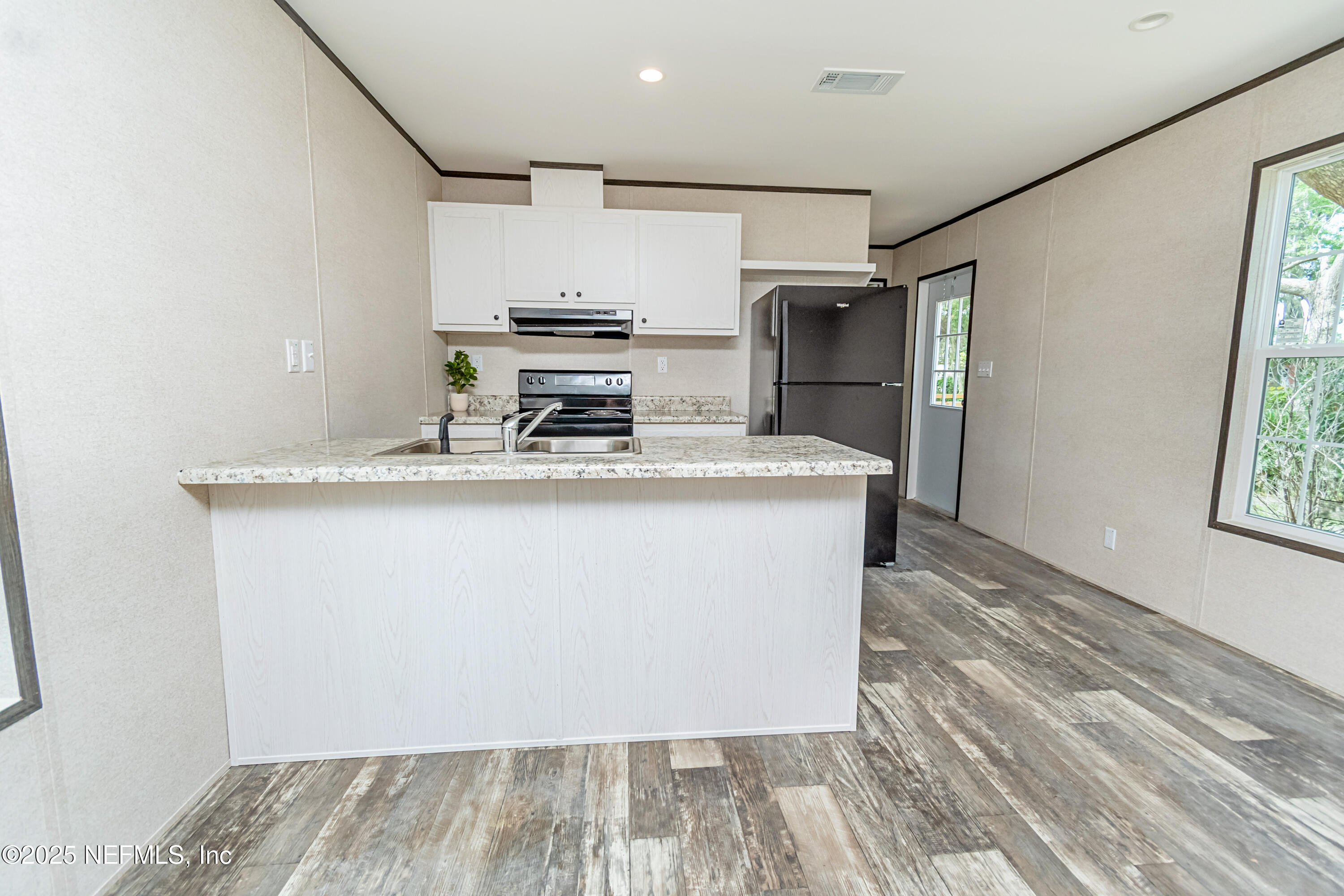 406 Sycamore Drive Macclenny, FL 32063 - Photo 4 of 22 a view of kitchen with stainless steel appliances granite countertop refrigerator sink and stove