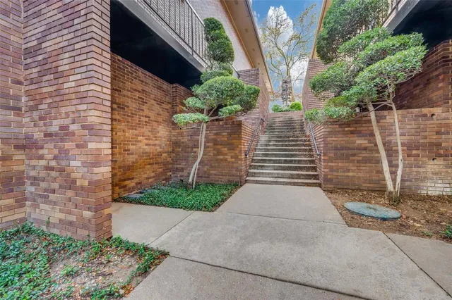 a backyard of a house with plants