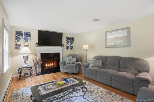 29 Hickory Hill Road Newburgh, NY 12550 - Photo 14 of 47 a living room with furniture a flat screen tv and a fireplace