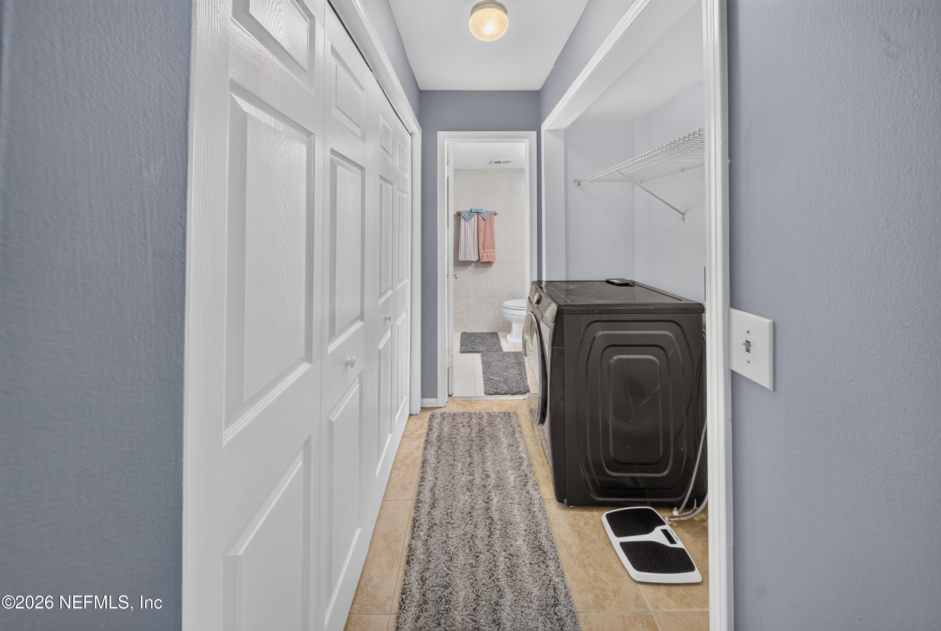 7346 El Barco Road, Unit 4 Jacksonville, FL 32216 - Photo 7 of 19 a view of a hallway with washer and dryer