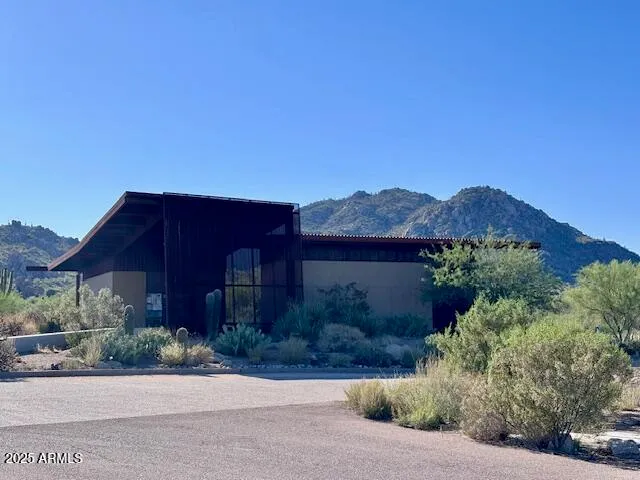 a front view of a house with a yard and a garage