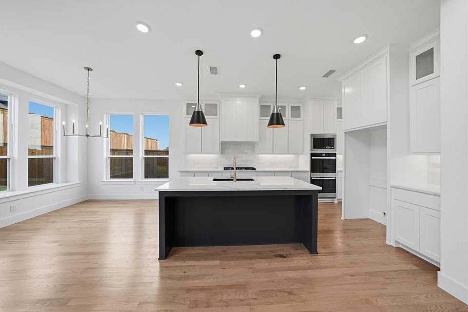 205 Ardsley Way Allen, TX 75013 - Photo 12 of 37 a view of kitchen with stainless steel appliances granite countertop a stove and a refrigerator