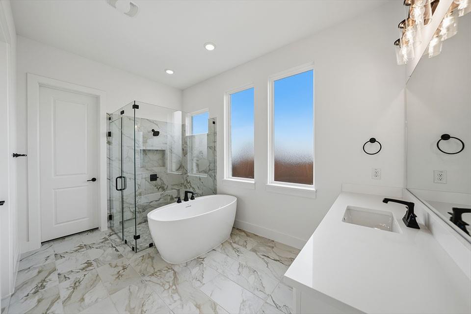 205 Ardsley Way Allen, TX 75013 - Photo 19 of 37 a bathroom with a bathtub sink and mirror