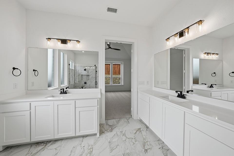 205 Ardsley Way Allen, TX 75013 - Photo 20 of 37 a spacious bathroom with 2 sink and a mirror