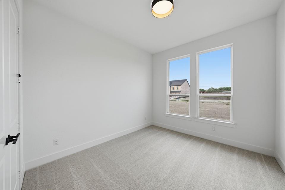 205 Ardsley Way Allen, TX 75013 - Photo 21 of 37 a view of an empty room with a window
