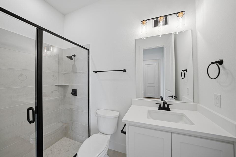 205 Ardsley Way Allen, TX 75013 - Photo 22 of 37 a bathroom with a sink a toilet and a mirror