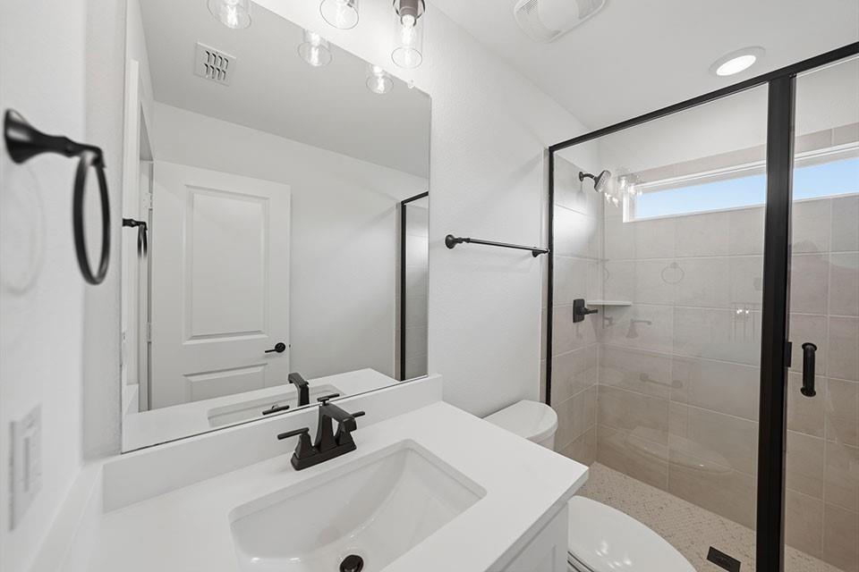 205 Ardsley Way Allen, TX 75013 - Photo 29 of 37 a bathroom with a sink a toilet and shower