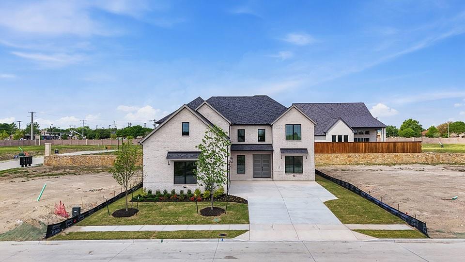 205 Ardsley Way Allen, TX 75013 - Photo 3 of 37 a view of house with garden space and swimming pool