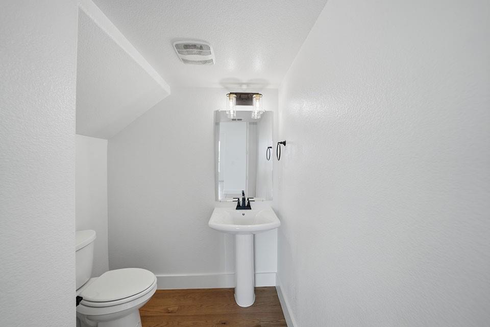 205 Ardsley Way Allen, TX 75013 - Photo 6 of 37 a bathroom with a sink a toilet