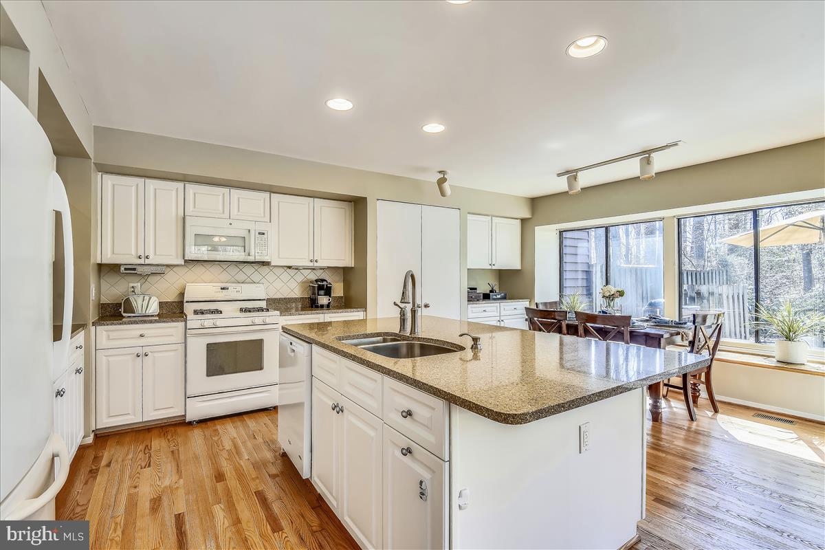 2021 Turtle Pond Drive Reston, VA 20191 - Photo 14 of 57 All new white cabinets and Silestone countertops